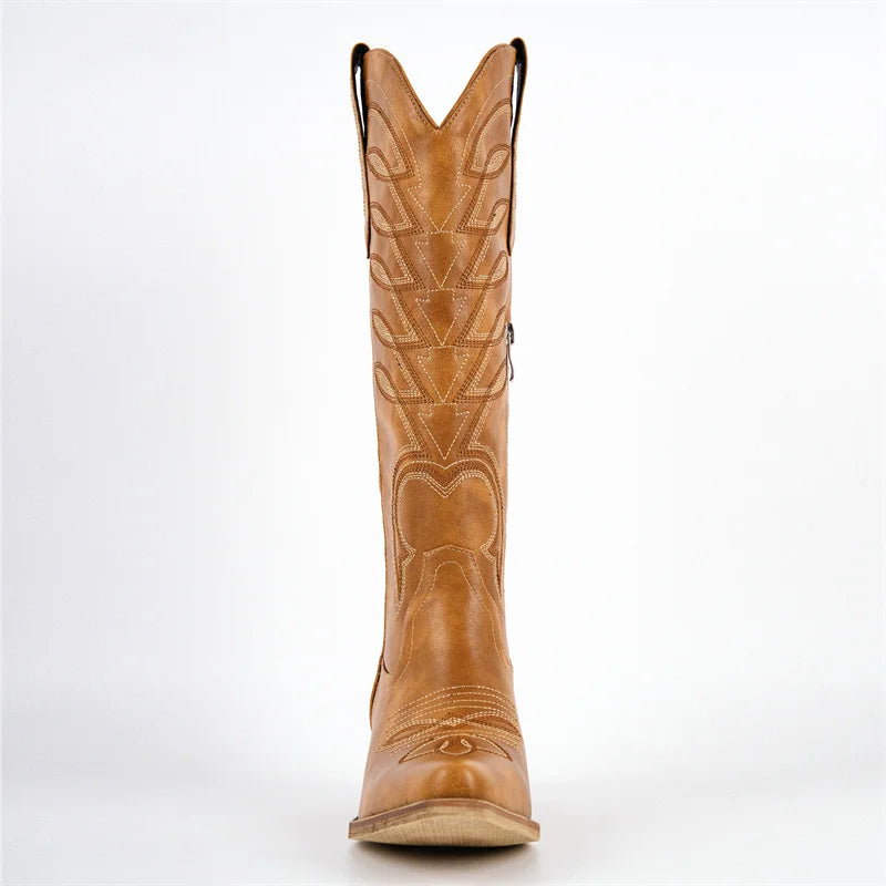 Front view of brown faux leather knee-high boot with pointed toe and embroidery