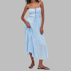 Woman wearing a light blue dress on a white background