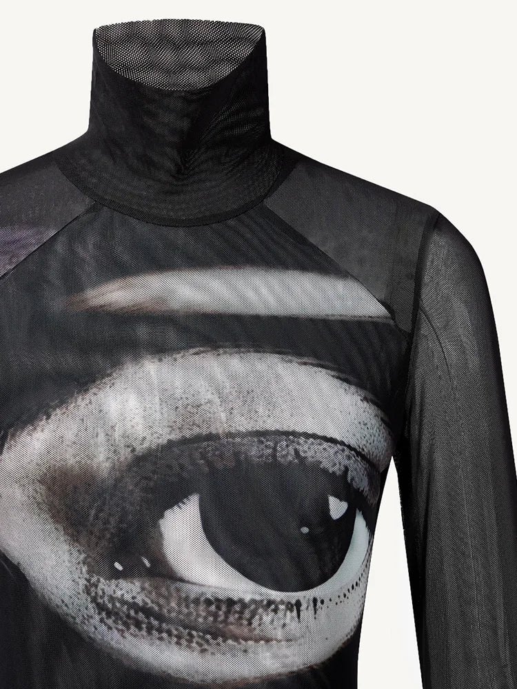 Black turtleneck shirt with a large eye design on a white background