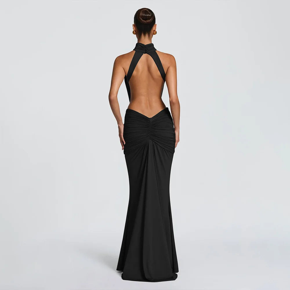 Black evening gown with open back on a white background