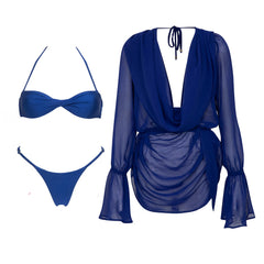 Blue bikini top and bottoms next to a sheer blue long-sleeved cover-up.