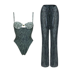 Zebra print one-piece swimsuit and cover-up pants laid flat