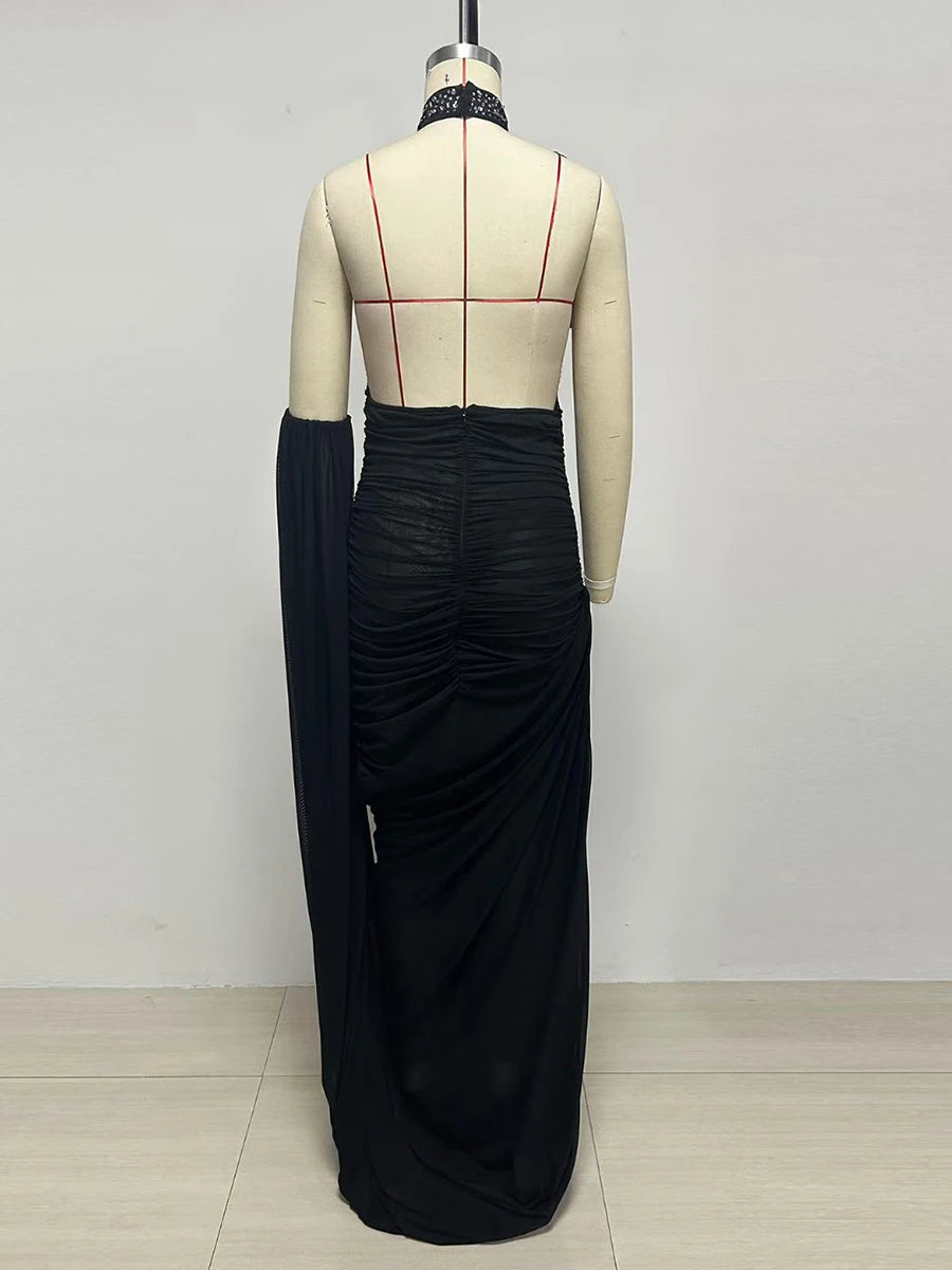 Back view of feather halter neck ruched maxi dress on mannequin