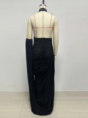 Back view of feather halter neck ruched maxi dress on mannequin