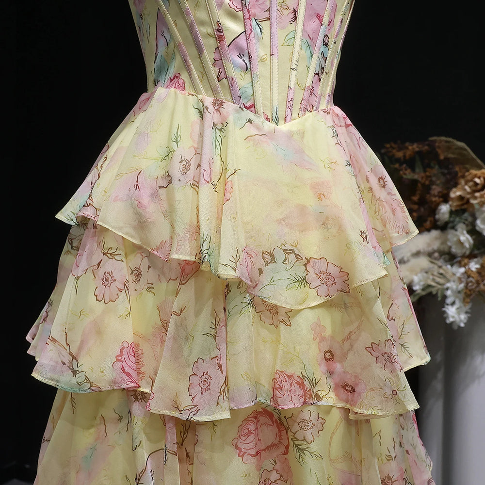 Floral dress with ruffled layers on a black background