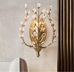 Decorative wall sconce with crystal accents on a neutral wall