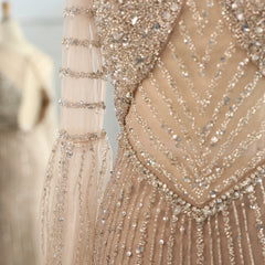  Close-up of the elegant cape sleeves and intricate detailing on the lilac Sharon Said gown. Golden Atelier 4