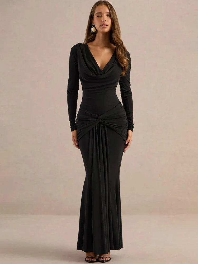Black draped cowl neck long sleeve maxi dress, model posing