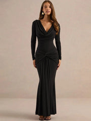 Black draped cowl neck long sleeve maxi dress, model posing