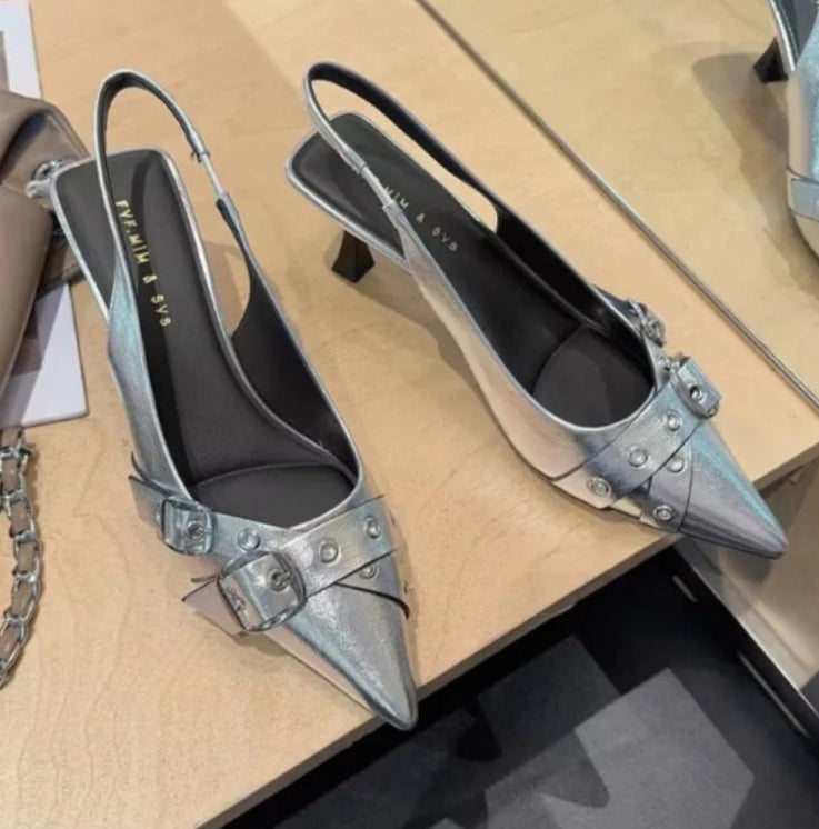 Minimalist white dress shoes on dark textured background