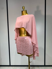 Pink two-piece set with floral sequin skirt and flowing cape