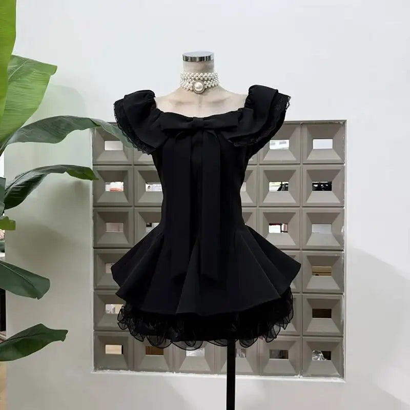 Off-shoulder bow frill mini dress in black