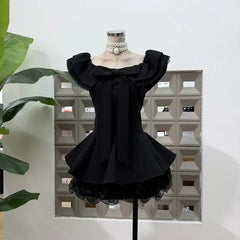 Off-shoulder bow frill mini dress in black