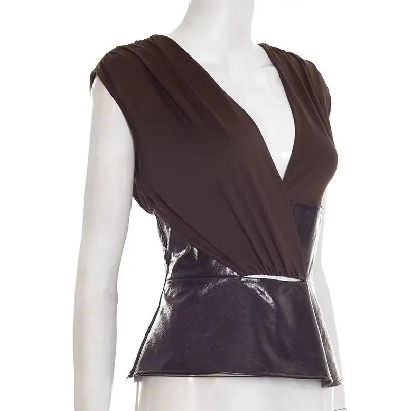 Brown sleeveless top with a deep neckline on a mannequin against a white background