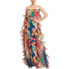 Tropical print one-piece swimsuit with ruffled skirt displayed on a mannequin.