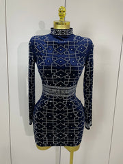Navy blue dress with white geometric pattern on a mannequin against a white background
