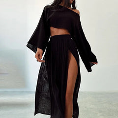 A model wearing a cotton linen two-piece set with a flare sleeve top and a slit long skirt. Black Golden Atelier 4