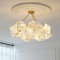 Close-up of a glass petal chandelier highlighting the intricate details of the glass petals and sparkling LED bulbs. A