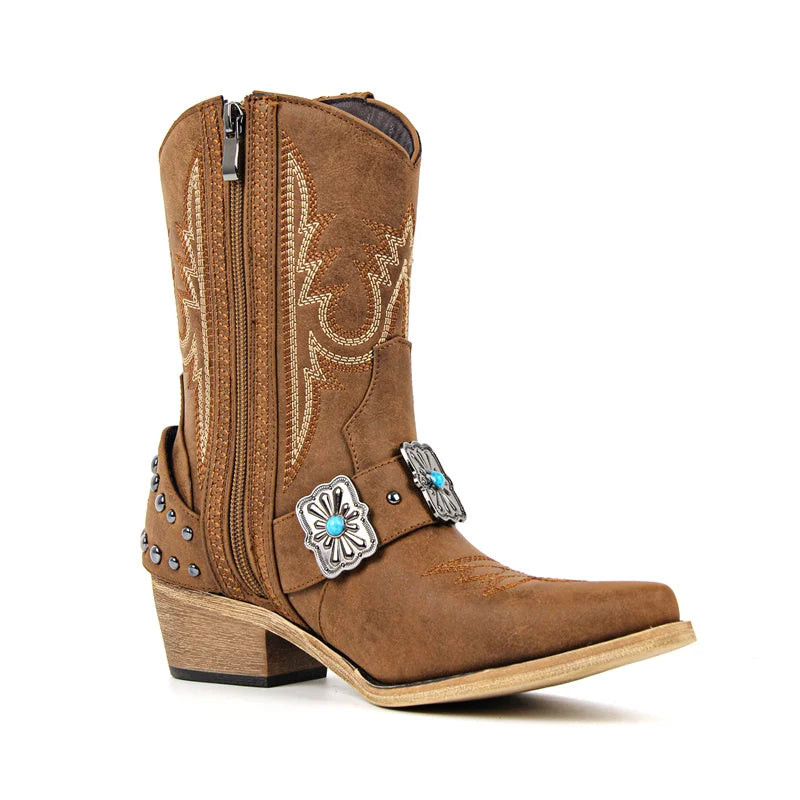 Brown western ankle boots with pointed toe and metal buckle accent