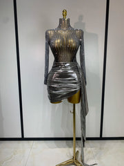Silver long sleeve turtleneck mini dress with embellishments and draped skirt