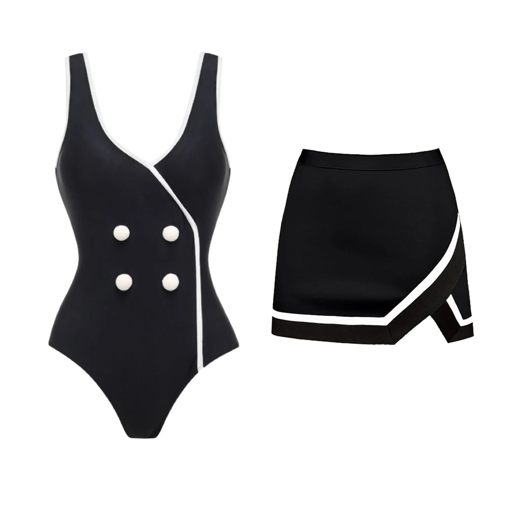 Black and white one-piece swimsuit and matching skirt set against a white background.