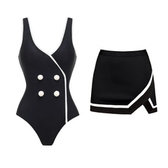 Black and white one-piece swimsuit and matching skirt set against a white background.