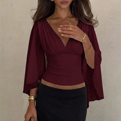 Ruched V-neck cape sleeve top in claret