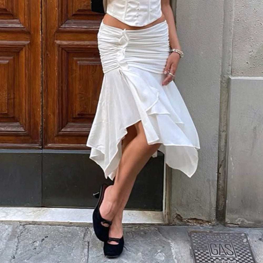 Model wearing an asymmetrical ruched slit midi skirt in an urban setting.