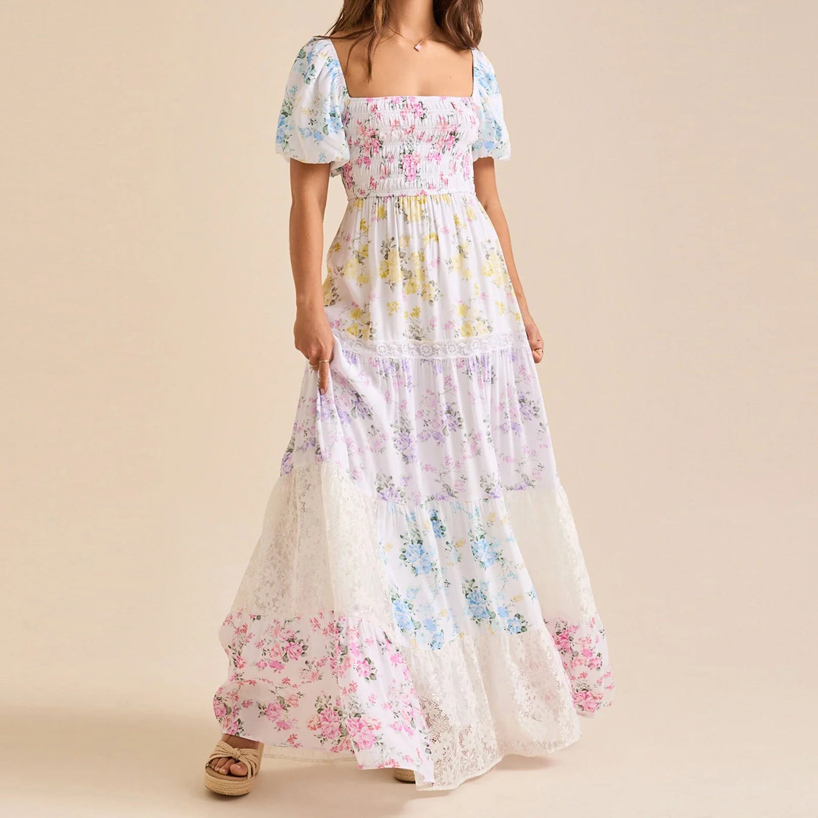 Woman wearing a floral off-shoulder dress on a beige background