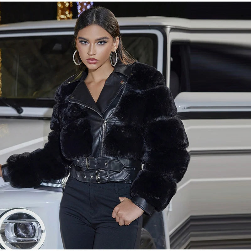 Woman wearing a black fur jacket in front of a car