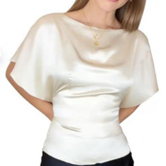 Woman wearing a white blouse with short sleeves on a white background