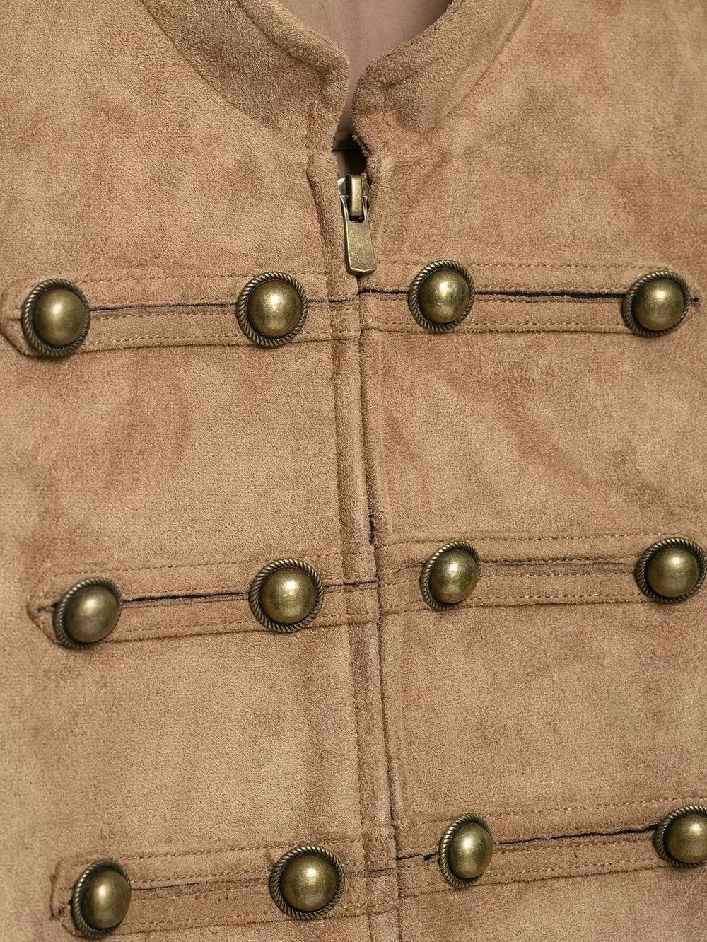Close-up of gold buttons on faux suede jacket