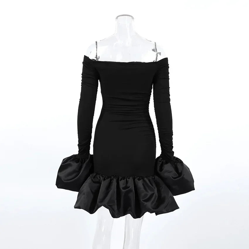 Black off-shoulder dress with long sleeves on a mannequin against a white background