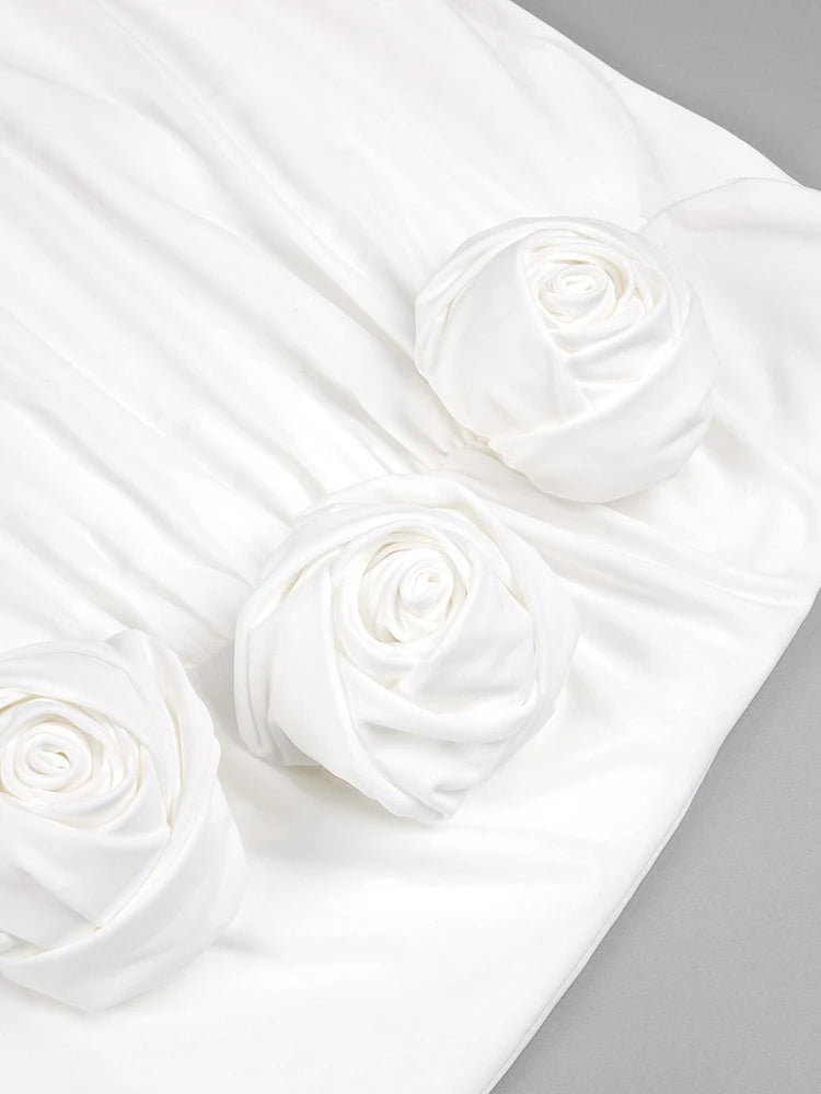White satin fabric with rose patterns on a gray background