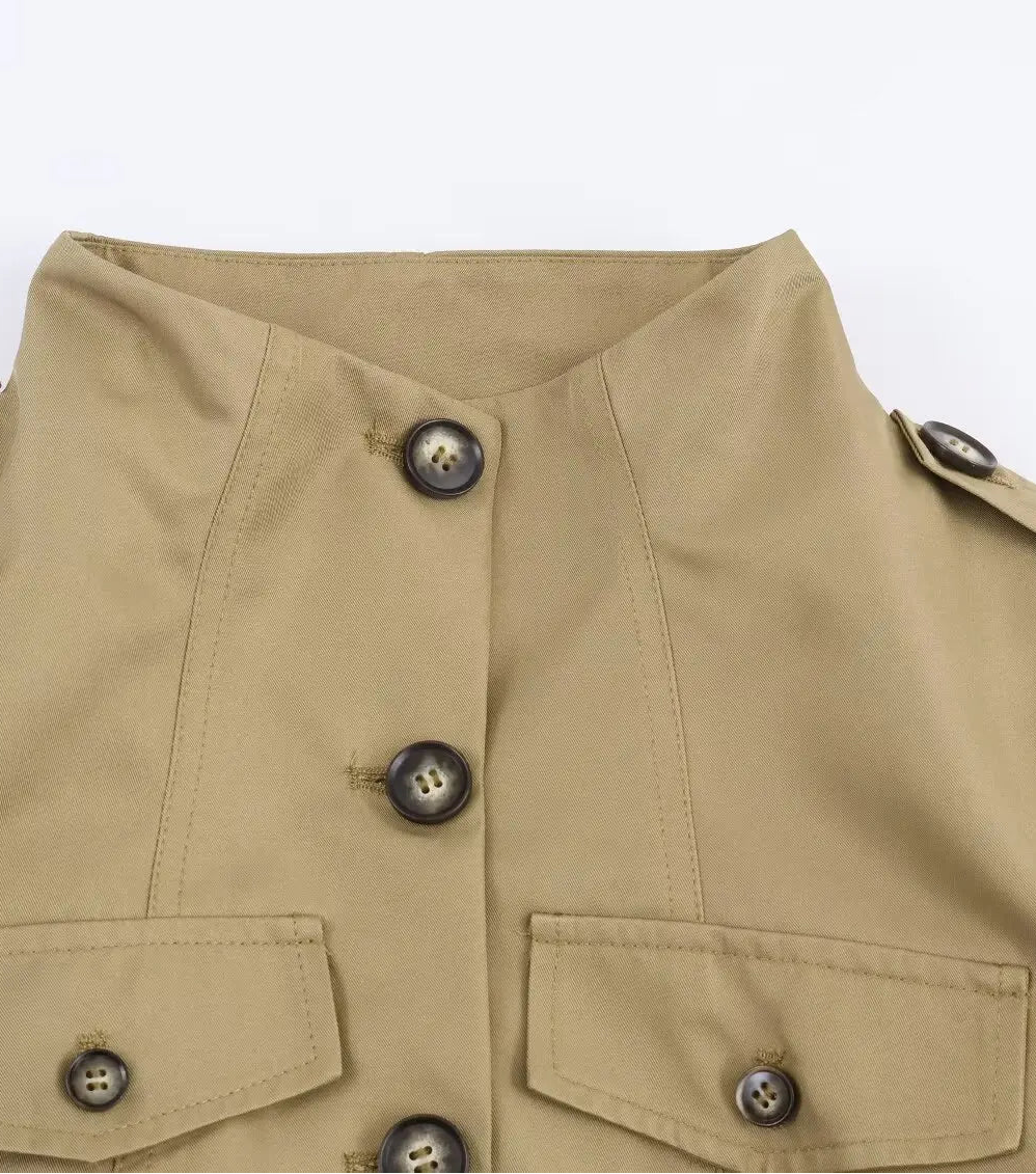 Close-up of a beige jacket with button details 