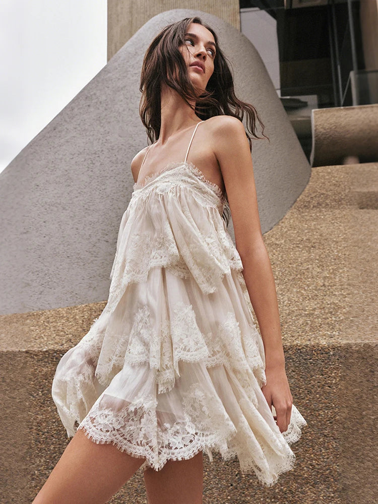 Beige lace trim halterneck mini dress in an urban setting