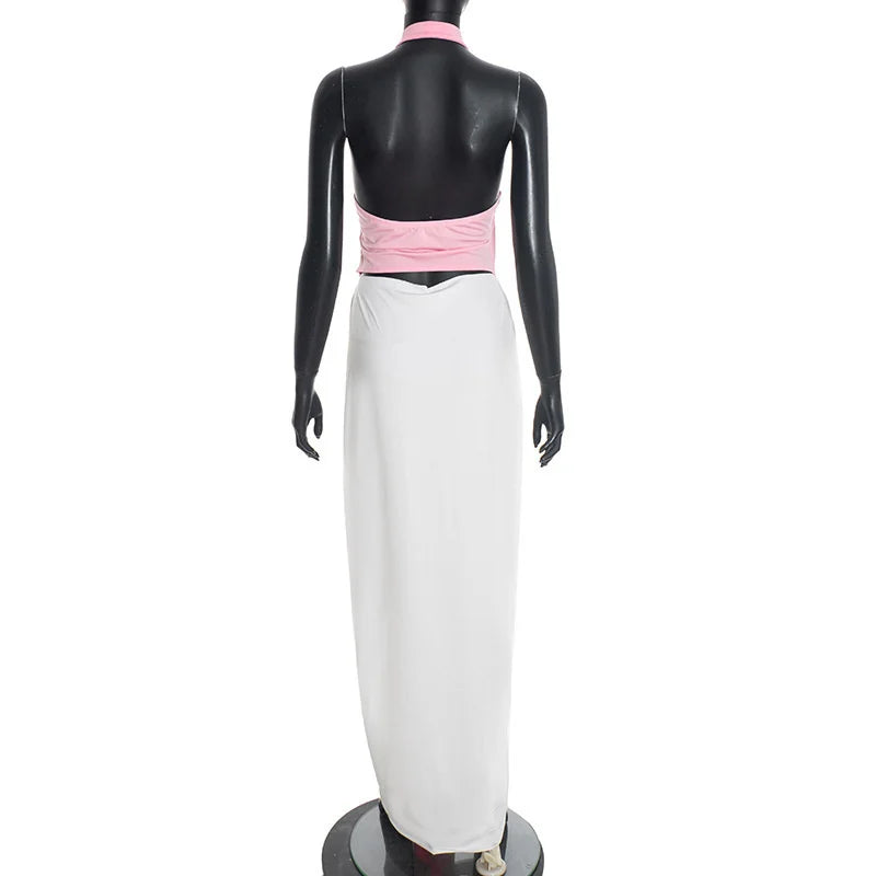 Mannequin wearing a pink top and white skirt on a white background