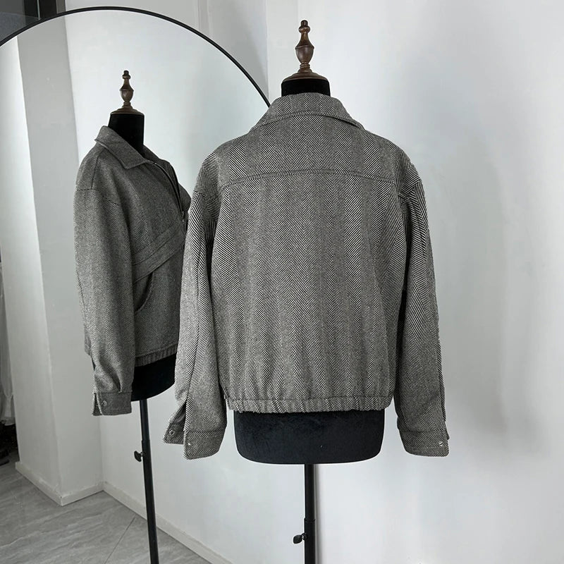Gray textured jacket displayed on a mannequin against a white background