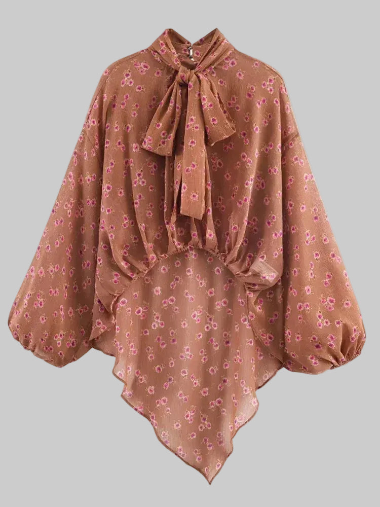 Brown floral blouse with a bow neckline on a white background