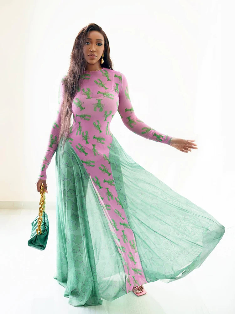 Woman wearing a pink and green dress with sheer green fabric