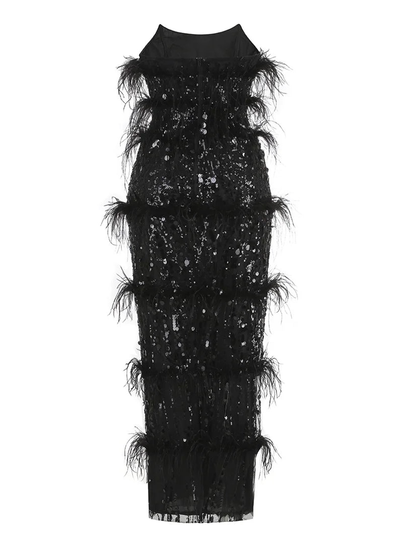 Full body shot of the black sequin and feather strapless evening gown.