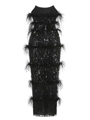 Full body shot of the black sequin and feather strapless evening gown.
