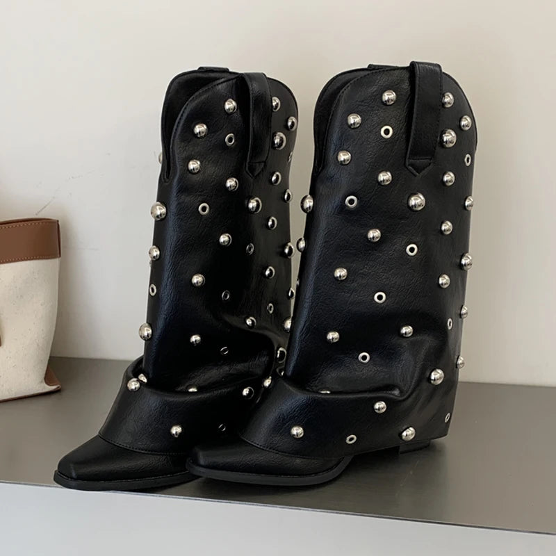 Black leather cowboy boots featuring stud embellishments.