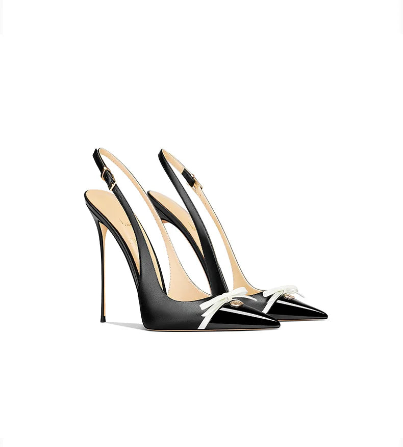 Black high-heeled shoes with beige interior on a white background