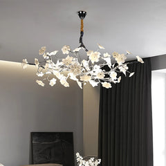 A modern floral chandelier with a chrome finish, illuminating a stylish living room. Golden Atelier 5