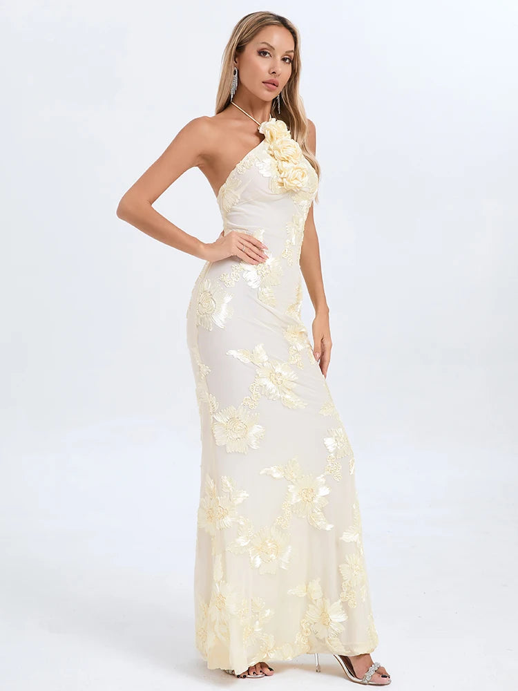 Woman wearing a white floral evening gown on a light gray background