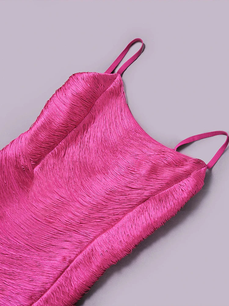 Pink feathered top on a light gray background