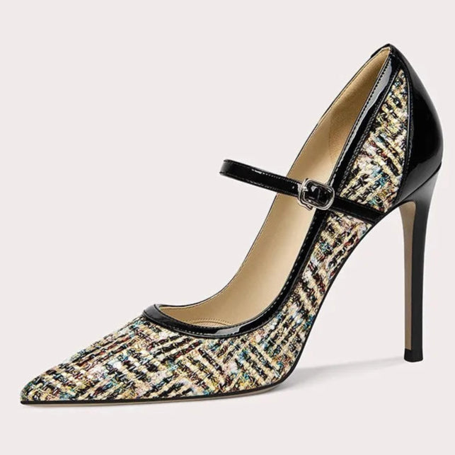 High-heeled shoe with patterned design and strap on a light gray background