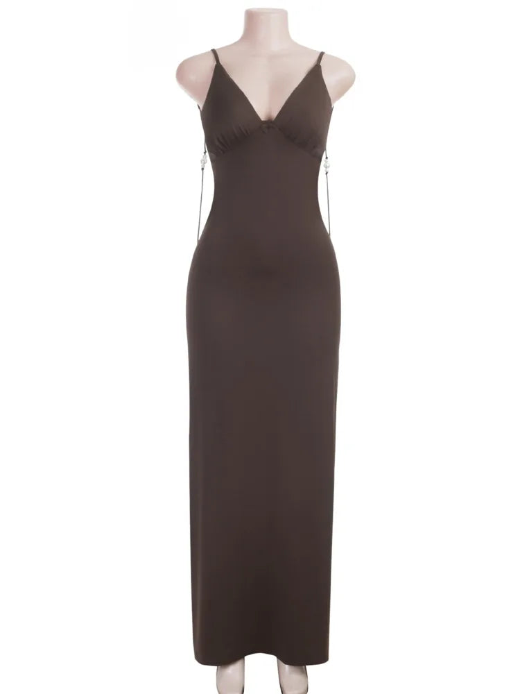 Brown dress on a mannequin against a white background