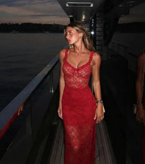 Red lace two-piece set worn on a yacht at dusk